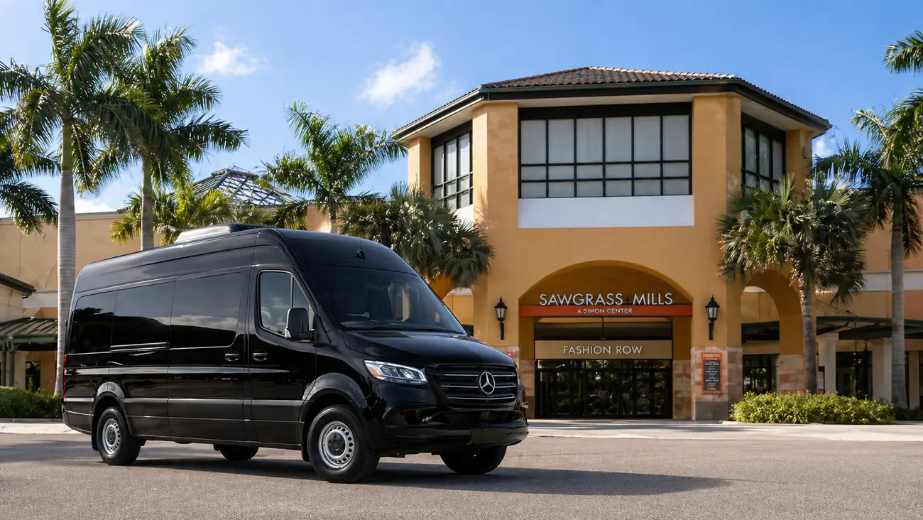 Van Mercedes Sprinter preta na frente do Sawgrass Mills em Miami, transporte privativo para o shopping center